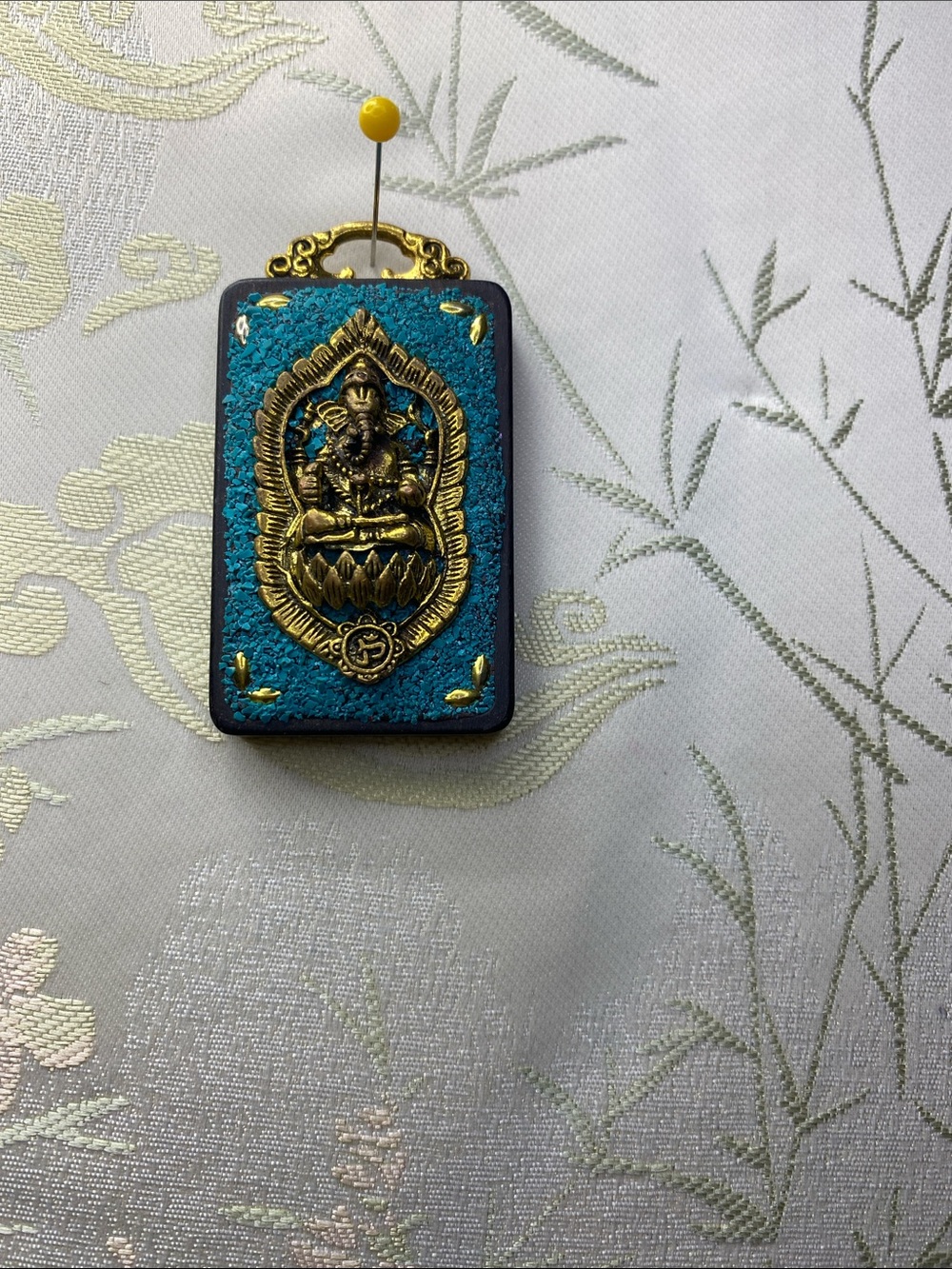 Gold lotus elephant Buddhist Pendant on Teal Rectangular Plaque